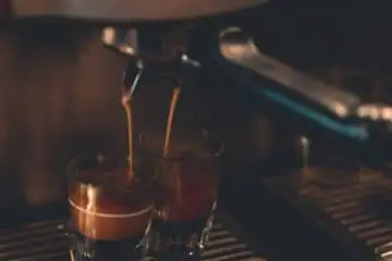 two cups of coffee from a coffee maker